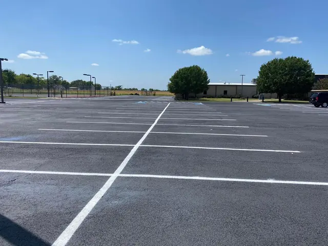 White parking lines across a broad asphalt lot